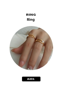 Detail of 18k gold plated double-band ring featuring a small white pearl embellishment