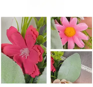 Detailed close-up of realistic pink cat wreath flowers and textured green leaves
