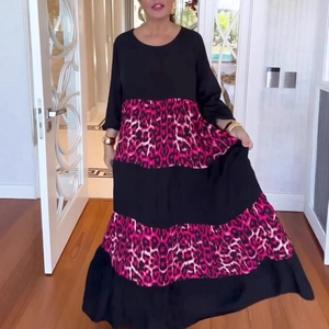 Detail of three-tier tiered maxi dress with black and pink leopard print patchwork