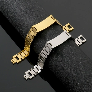 Close-up of gold and silver stainless steel watch-style link bracelets with ID plates
