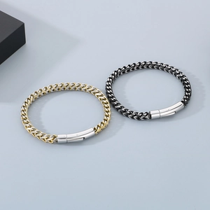 Detailed view of woven stainless steel chain bracelets with spring clasps in silver and gold