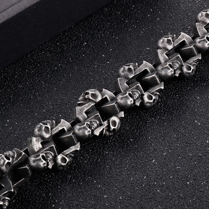 Close-up of heavy punk skull chain bracelet with vintage oxidized finish on steel