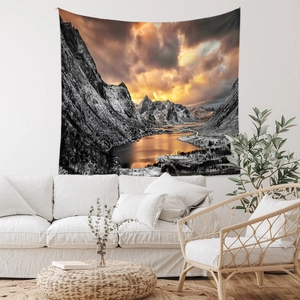 Detail view of sunset mountain lake tapestry in a minimalist Nordic living room setting