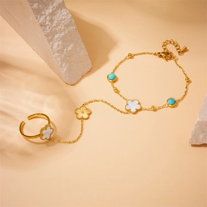 Boho golden flower finger bracelet with blue turquoise and white shell petals