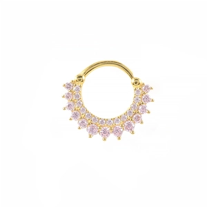 Macro detail of golden septum ring featuring double rows of delicate pink zircon stones