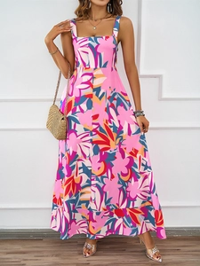 Detailed close-up of summer floral maxi dress with vibrant print and flowing A-line silhouette