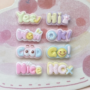 Detailed view of colorful resin charms with fun English words and expressive icons
