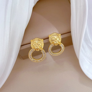 Luxurious gold lion head earrings with micro-pave zircon crystals for a vintage look
