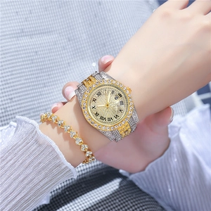 Close-up of a two-tone rhinestone watch and matching heart-shaped crystal bracelet set