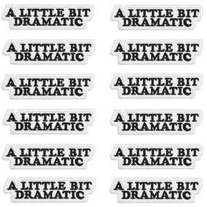12-pack of A Little Bit Dramatic embroidered iron-on patches with black text on white background