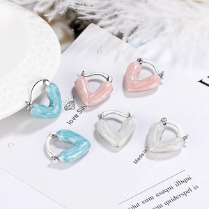 Elegant heart-shaped enamel hoop earrings in blue, pink, and white with silver plating