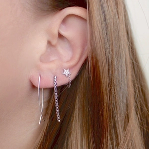 Elegant S925 silver star tassel earrings with rhinestones for women on model ear