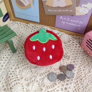 Detailed view of mini plush strawberry coin purse with soft texture and metal bead chain