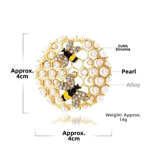 Detailed macro of 4cm gold honeycomb brooch with bees, pearls and rhinestones