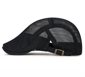 Detail of breathable black mesh fabric and bronze metal buckle on the summer flat cap