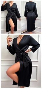 Detailed view of black satin bathrobe showing silk texture and belted waist design