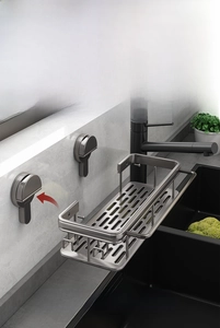 Detail of suction cup dishcloth rack with hollow metal basket for kitchen sinks