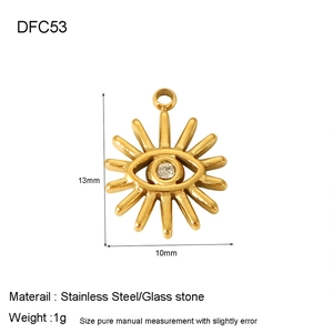 Detailed close-up of golden stainless steel evil eye charm with sunburst engraving