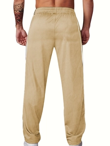 Vue arrière du pantalon en velours côtelé kaki avec taille élastique et rayures blanches