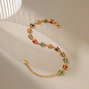 18K gold plated bracelet featuring colorful enamel butterflies and adjustable chain