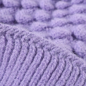 Winter knit beanie for women in purple with ribbed texture and warm fleece lining