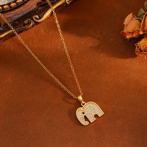 Detailed view of a gold elephant pendant necklace featuring sparkling zircon inlay details