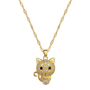 Luxurious gold cat pendant necklace with pavé zircons and bow detail on a flat chain