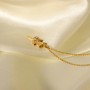18K gold plated 3D rose pendant necklace with fine chain on elegant silk background