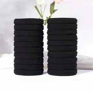 Close-up of seamless black high-elastic hair ties in a double-stacked arrangement