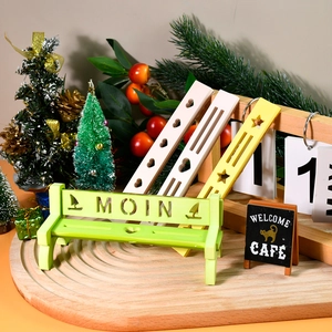 Miniature wooden park bench ornaments with hollow star and heart designs in multiple colors