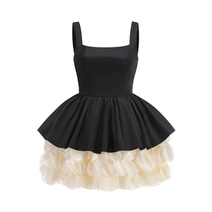 Detailed shot of tiered petal-shaped skirt on vintage black and white cocktail dress