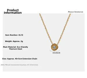 Detail view of gold geometric hexagonal pendant with sparkling cubic zirconia inlay