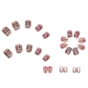 Short press-on nails with punk chrome hearts designs and pink grid patterns set