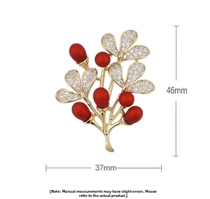Detailed view of the red berry tree brooch with dimensions of 46mm height and 37mm width