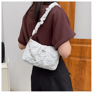 Rear view of white pleated fabric shoulder bag with metal chain strap for women