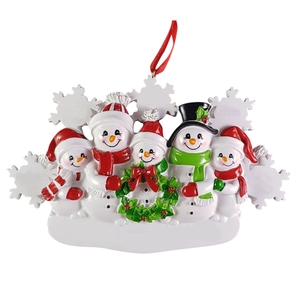 Resin Christmas ornament featuring five cute snowmen family with wreath and red ribbon