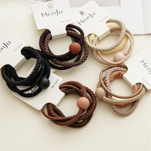 Close-up of high-elastic hair tie set with matte beads in neutral earth tones