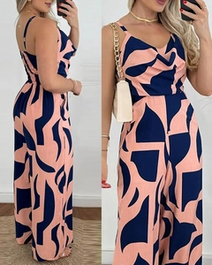 Front and side view of navy blue and pink geometric print wide-leg sleeveless jumpsuit