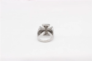 Close-up of silver stainless steel cross ring with intricate hollowed-out cross design