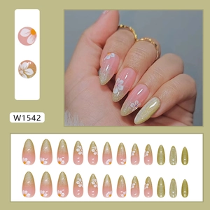 Pink cat eye almond press-on nails with white floral patterns and glitter gradient finish