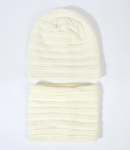 Detail of cream white knit beanie and neck warmer set showing soft ribbed texture