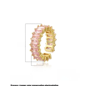 Detailed view of luxury gold copper ring featuring pink rectangular zircon stones