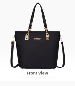 Front view of black litchi texture tote bag with golden chain and metallic logo detail