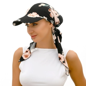 Detail of 100% polyester fabric label on a floral print headwrap with long ribbons