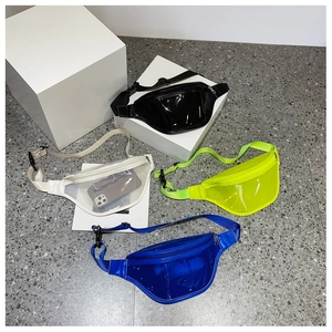 Flat lay of colorful transparent PVC waist bags showing various color options and storage capacity