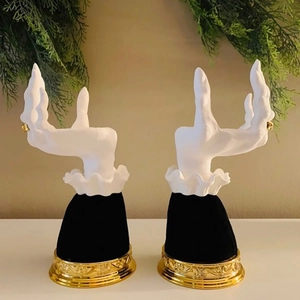 Set of two Victorian witch hand jewelry display trays with gold embossed metal base