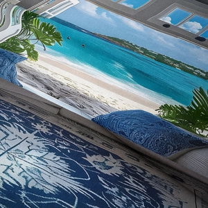 Detail of beach print on tapestry featuring blue ocean, white sand and green plants