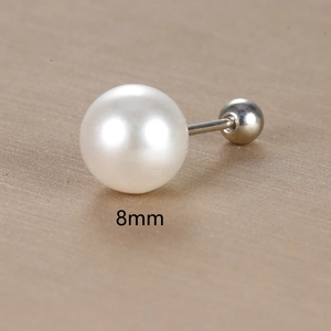 Detailed view of an 8mm white pearl stud earring with silver metal screw back ball