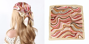 Detail of elegant butterfly and wave pattern silk scarf shown on model and flat lay