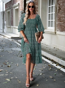 Detail of square neck floral maxi dress with lantern sleeves in green floral print